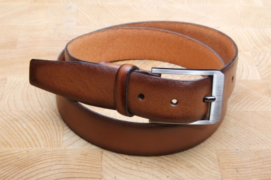 <h5>2034 35</h5><p>Made in Germany belt " Softy" in black and cognac. Width 3,5 cm and length available till 115 cm.
Description: Moulded, not stitched  and shortable</p>